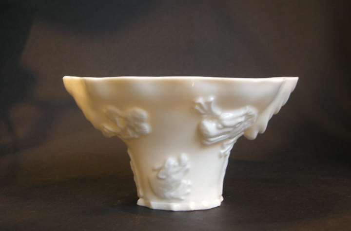 White porcelain libation blanc de Chine porcelain cup in the shape of rhinoceros horn
